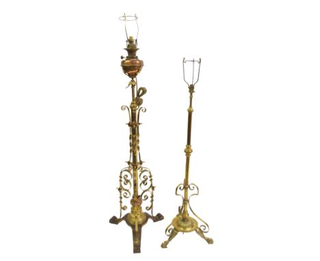 A Victorian brass standard oil lamp the telescopic column joined by three scrolling brackets surrounding an acanthus knop and