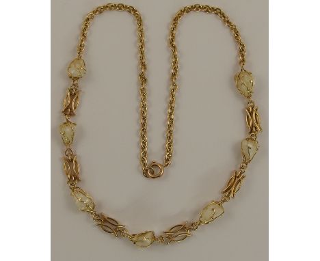 A freshwater mussel baroque pearl necklace the pearls are held in freeform cage mounts with a fancy link in between each, mou