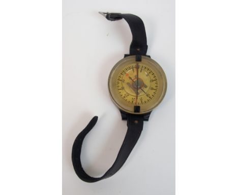 A WWII Luftwaffe Pilot's wrist compass by Kadlec marked AK39 (Armband Kompass 1939) and F123235-1 with cross-hair, 6cm diamet