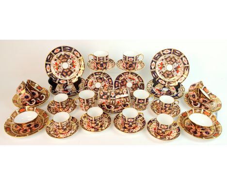 A Royal Crown Derby Imari pattern tea and coffee set pattern 1128, six shallow tea cups and six saucers.  Pattern 2451, six s