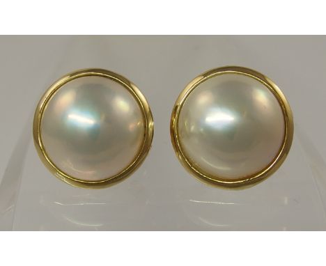 A pair of 18ct gold Italian made, Mabe pearl earrings with clip and post to the reverse, size of pearls 14mm