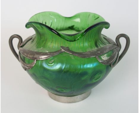 An early 20th Century pewter mounted Art Nouveau Loetz Rusticana green glass bowl the twin handled pewter mounts of whiplash 