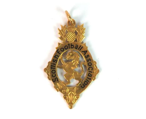 A 9ct gold and enamel 1960-61 Scottish Cup Runners-up medal the obverse inscribed Scottish Football Association, the reverse 