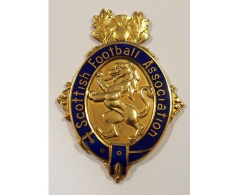 A 9ct gold and enamel 1976-77 Scottish Cup runners-up medal the obverse inscribed Scottish Football Association, the reverse 