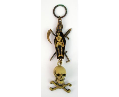A 19th century Masonic 'Memento mori' pendant the ring suspender above an owl with open coffin beneath revealing a cold paint