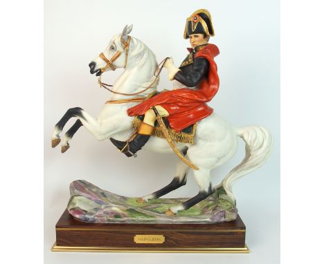 A Royal Worcester equestrian figure of Napoleon Bonaparte modelled by Bernard Winskill mounted on a brass banded rosewood sta