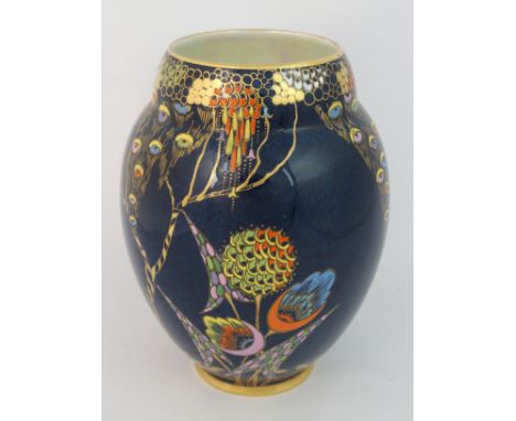 A Carlton Ware Devils Copse vase Art Deco enamelled stylised flowers and foliage on a dark blue ground, printed and painted m