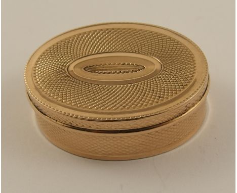 A yellow metal vinaigrette with all over engine turned decoration, and internal decorative grill, approx dimensions 35mm x 26