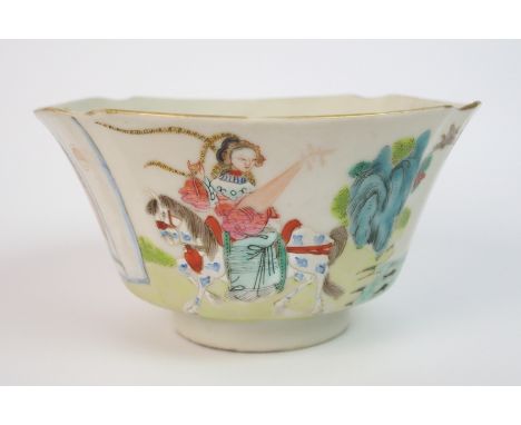 A Chinese famille rose shaped bowl painted with four panels of figures in gardens and at a window (hairline crack), Daoguang 