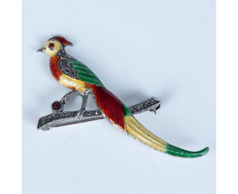 Beautiful colorful enamel bird set in sterling silver. The long flowing tail feathers sweep far below the marcasite branch th