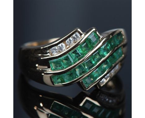 Beautiful pure 14k gold ring with channel-set natural diamonds and emeralds. The total weight is 4.70g and it is a size 6.5. 