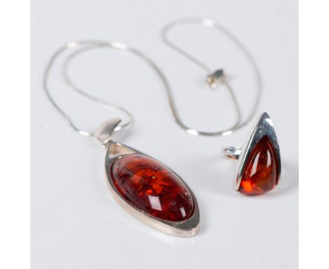 Beautiful necklace and ring made from amber and sterling silver. All pieces are stamped 925. The pendant measures 2.75"L x 1"