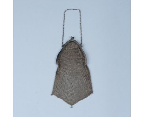 Fabulous bag in impeccable condition. The sterling silver frame has scroll work engraved on it with a kiss lock clasp with pu