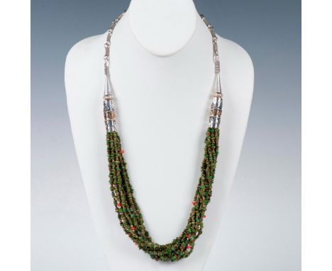 Handmade Native American necklace signed by Navajo artist, Mike Alcott. Multiple strands of green turquoise chips and coral p