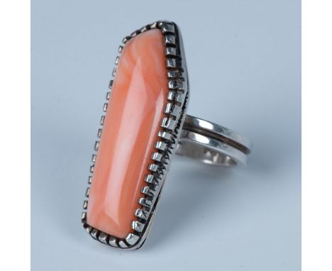 Striking pink coral surrounded by an abstract beaded sterling silver edge make this large ring a great find. The sterling sil