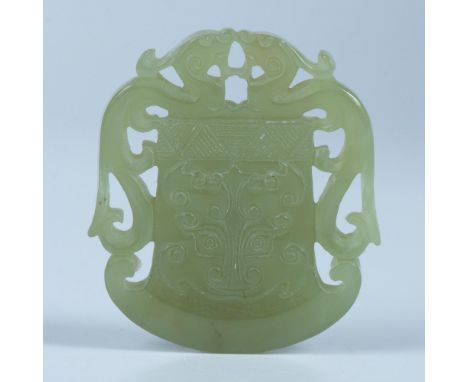 Hand carved and polished jade pendant featuring two dragons and a center tiger head. 1.90"L x 1.65"W. Issued: 20th centuryCou