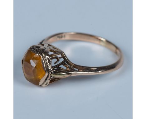 This beautiful ring features a yellow citrine stone in an engraved open gallery setting. The band is stamped 10k. Size 8.25. 