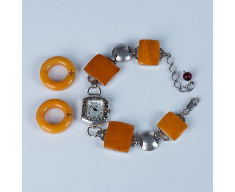 Large square polished butterscotch amber connected with round sterling silver discs form the watch band. Lobster clasp and ch