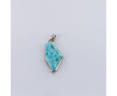 Uniquely shaped stone in a beautiful blue with a hint of green makes this a special piece. Surrounded by sterling silver with