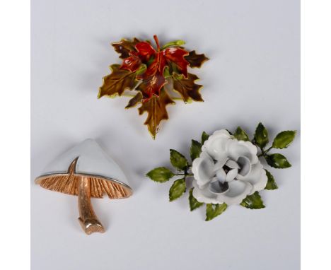All of these fun brooches are three dimensional. The maple leaf has a gold tone back with enamel that is a beautiful combinat