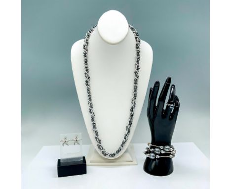 The ring is sterling silver set with a faux blue pearl and it a size 6. The bracelet is silver tone metal with faux blue pear
