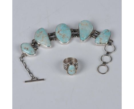 Beautiful serene blue stones in various shapes form this Michael Perry bracelet. Set in sterling silver with double hinged li