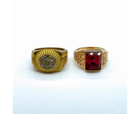 The 18k gold filled ring with small clear rhinestones is a size 11.5. The gold filled ring with a red stone is a size 11. Con