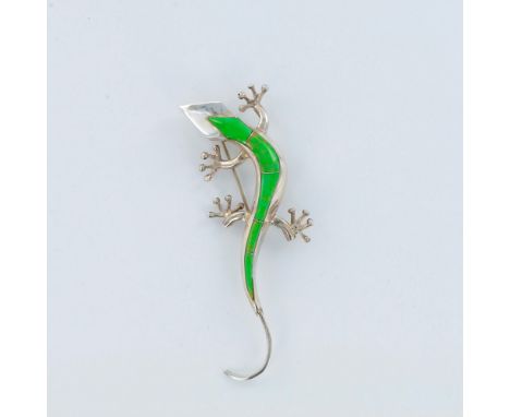This fabulous sterling silver gecko pin has vibrant green turquoise inlay up the spine. This gecko looks so real you might th