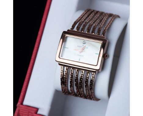 Lovely rose gold tone watch with a quartz movement. The mother of pearl face is marked Anne Klein Diamond. Stainless steel ca