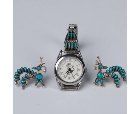 The fabulous screw back earrings are needlepoint turquoise and sterling silver. This stylized quail has two shades of turquoi