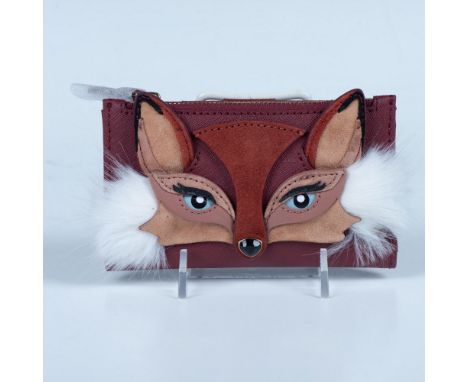 So cute this bifold wallet has striking detail. It is made of leather and suede with faux fur accents and a faceted stone nos