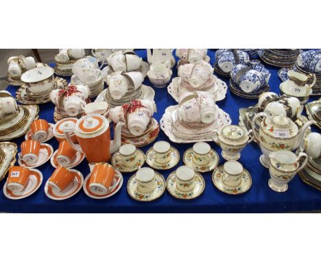 An Aynsley coffee set decorated with fruit on a cream ground, a Royal Copenhagen coffee set on orange and gilt, a Paragon Roc