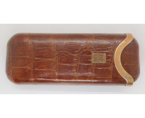 An Asprey cigar case. The crocodile case mounted in 9ct gold with full Asprey hallmarks, (A &amp; Co Ltd) London 1927, dimens