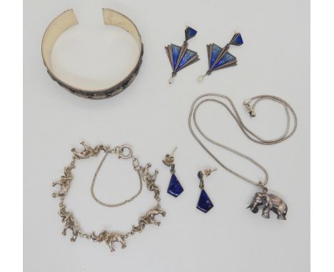 A detailed silver elephant pendant on chain, together with an elephant bangle and bracelet, length 16cm, a pair of enamel ear