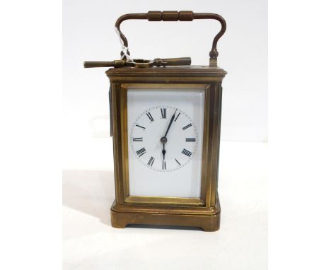 A brass and glass repeating carriage clock, with roman numerals to the dial Condition Report:Has key, however the door has be