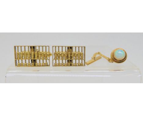 A pair of 14k gold abacus cufflinks, and an opal set tie stud, weigh together 7.7gms Condition Report:Available upon request