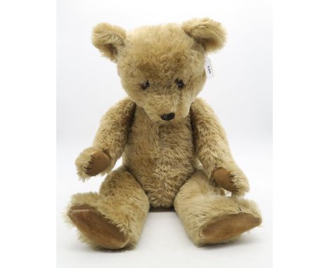 A large teddy bear, possibly by Chad Valley, with velvet paws, approximately 39cm high when seated (as in photograph) Conditi