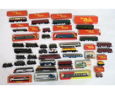 A quantity of 00-Gauge model railway locomotives and stock, largely by Hornby and Tri-ang, many boxed; others by Bachmann and