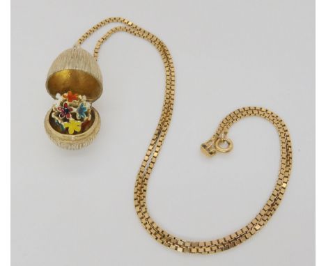 A silver gilt Stuart Devlin surprise egg pendant, on a 9ct gold box chain, length 44cm, weight 5.6gms, silver egg weight 9.8g