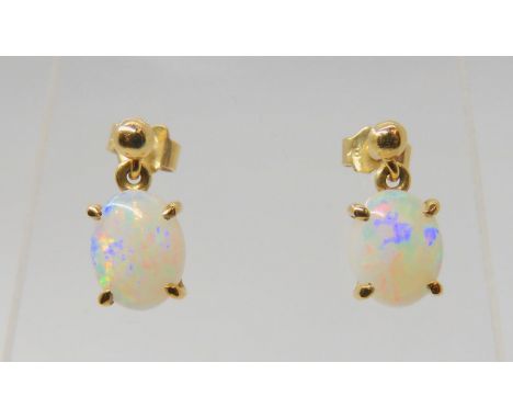 A pair of bright&nbsp; yellow metal white opal earrings, opals approx 9mm x 7mm x 2.8mm, weight together 2.2gms, (butterflies