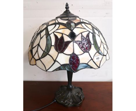 A 20th century cast metal based table lamp with Tiffany style leaded stained glass shade, 53cm high x 41cm diameter Condition