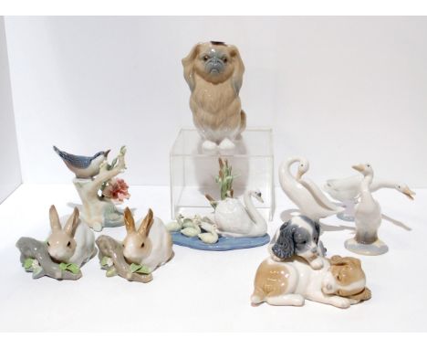 Eight Lladro animal and bird figures together with a Nao example Condition Report:bird on branch damage to flower, a few smal