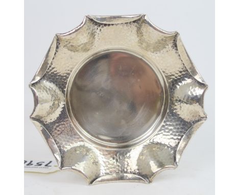 A Victorian silver arts and crafts style dish, the body with a hammered finish, with a fold over pie crust rim, by&nbsp;Army 