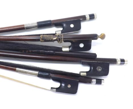 Four various unstamped old nickel mounted double bass bows; also a double bass bow stick, unstamped (5)