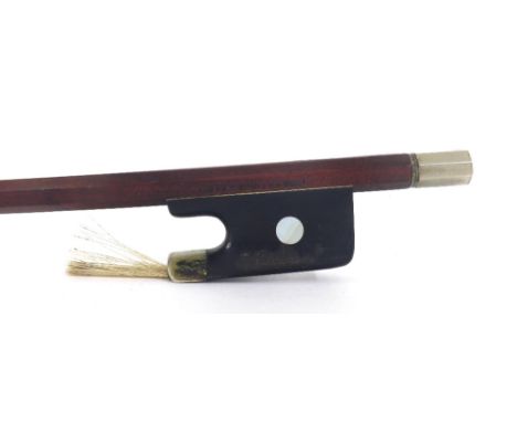 French nickel mounted violin bow stamped Vtor Fetique á Paris, the stick round, the ebony frog inlaid with pearl eyes and wit