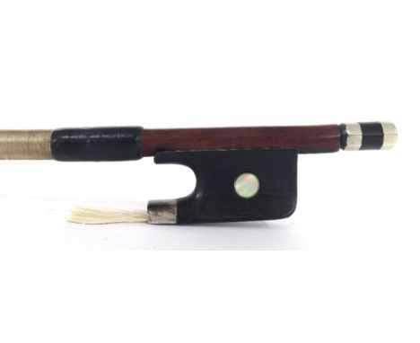 Interesting violoncello bow, unstamped, the stick round, the ebony frog inlaid with pearl eyes and the ebony adjuster with tw