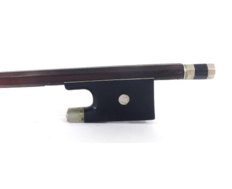 French nickel mounted violin bow of the J.J. Martin School, unstamped, the stick round, the ebony frog inlaid with pearl eyes