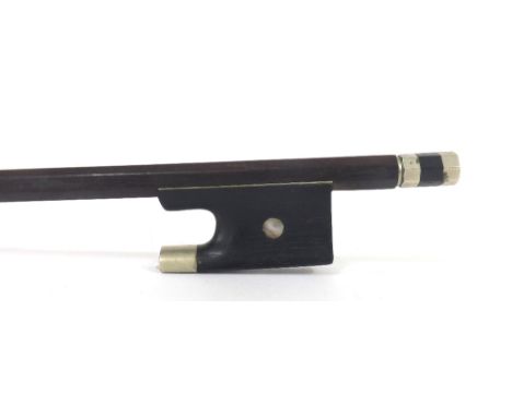 French nickel mounted violin bow of the Simon School, the stick round, the ebony frog inlaid with pearl eyes and the ebony ad