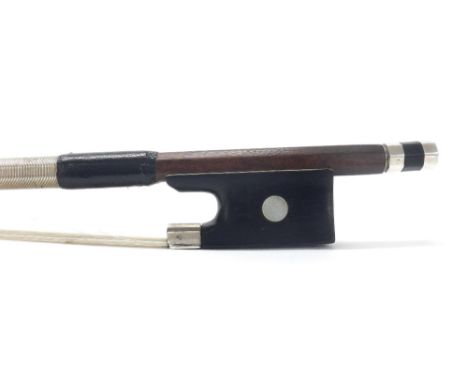 French silver mounted violin bow by and faintly stamped Francois Lotte, the stick round, the ebony frog inlaid with pearl eye