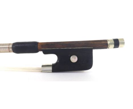 Nickel mounted violoncello bow stamped Emile Ouchard, the stick round, the ebony frog inlaid with pearl eyes and the ebony ad